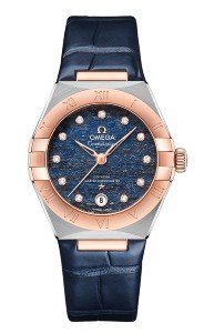 Rose gold and sterling silver details around a midnight blue face and blue alligator leather band by Omega