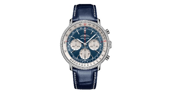 a silver Breitling watch with three subdials and a deep blue dial and strap