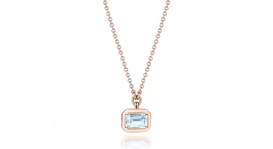 A rose gold pendant necklace with a blue emerald cut gemstone, available at Swiss Watch Gallery and Fine Jewelry.