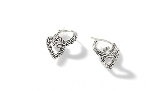 A white gold pair of hoop earrings with heart motifs, available at Swiss Watch Gallery and Fine Jewelry.