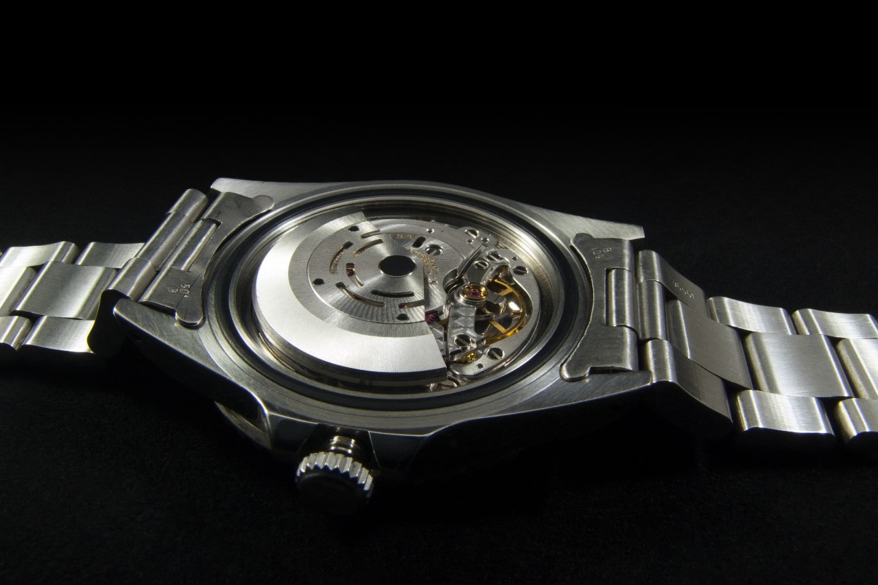 an automatic watch with the back removed