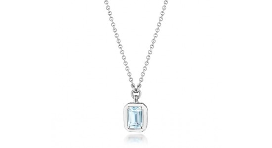 a white gold pendant necklace featuring an emerald cut topaz center stone