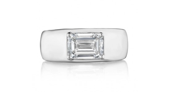 a silver fashion ring with a wide band and an emerald cut diamond