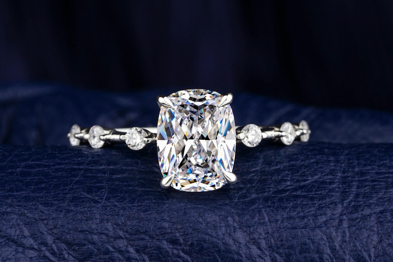 A close-up of a stunning solitaire engagement ring with an ornate band.